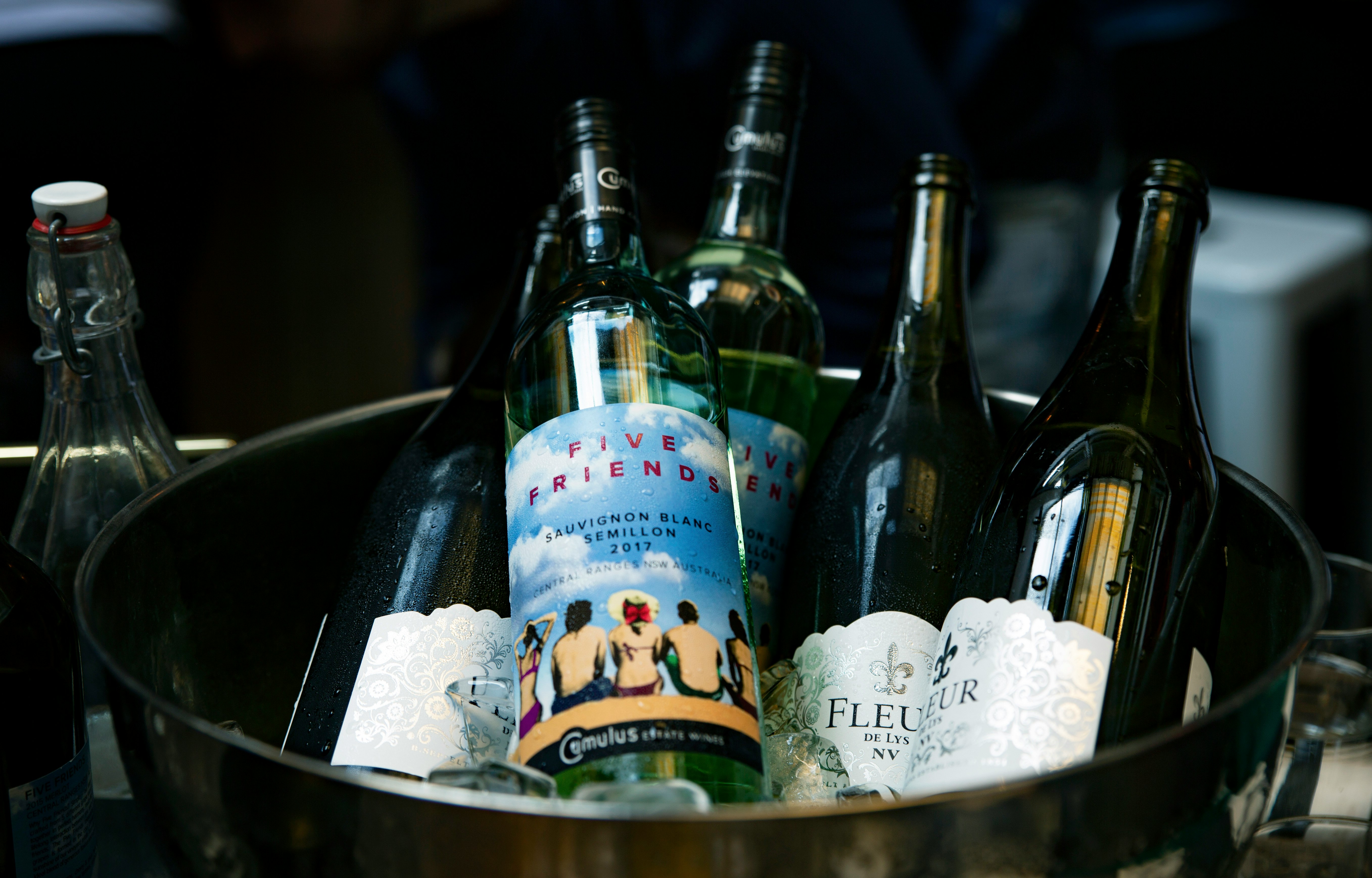 blue labeled bottles in bucket